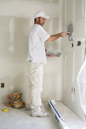 Drywall repair being performed by an experienced Precision Repainting drywall technician.